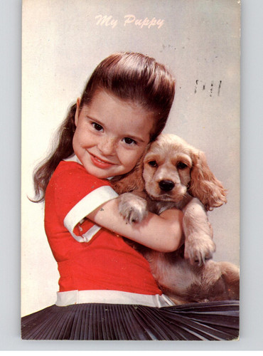 Puppy girl holding golden - puppy,